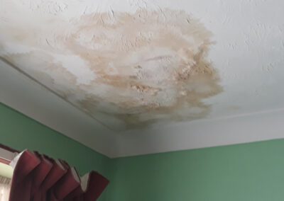 Damp patch on bedroom ceiling